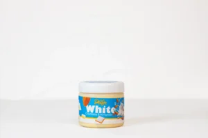 A creamy white chocolate and whole almond spread in a 200g jar.